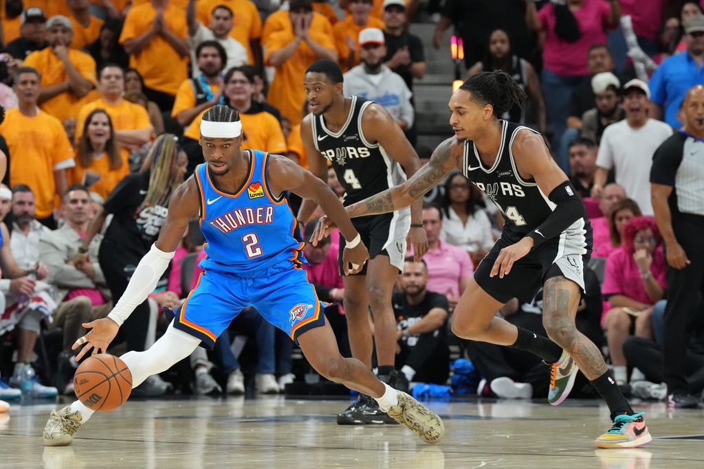 May 22, 2026; San Antonio, Texas, USA; Oklahoma City Thunder guard Shai Gilgeous-Alexander (2) dribbles the ball against San Antonio Spurs guard Devin Vassell (24) in the second half during game three of the western conference finals for the 2026 NBA playoffs at Frost Bank Center. Mandatory Credit: Scott Wachter-Imagn Images