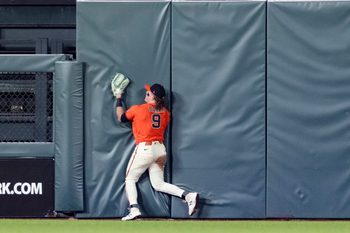 May 22, 2026; San Francisco, California, USA; San Francisco Giants center fielder Harrison Bader (9) hits the wall after catching a deep fly ball against the Chicago White Sox  during the ninth inning at Oracle Park. Mandatory Credit: John Hefti-Imagn Images