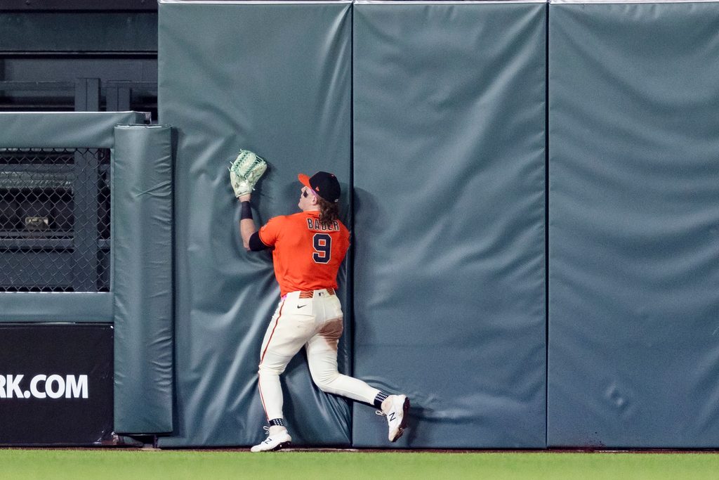 May 22, 2026; San Francisco, California, USA; San Francisco Giants center fielder Harrison Bader (9) hits the wall after catching a deep fly ball against the Chicago White Sox during the ninth inning at Oracle Park. Mandatory Credit: John Hefti-Imagn Images