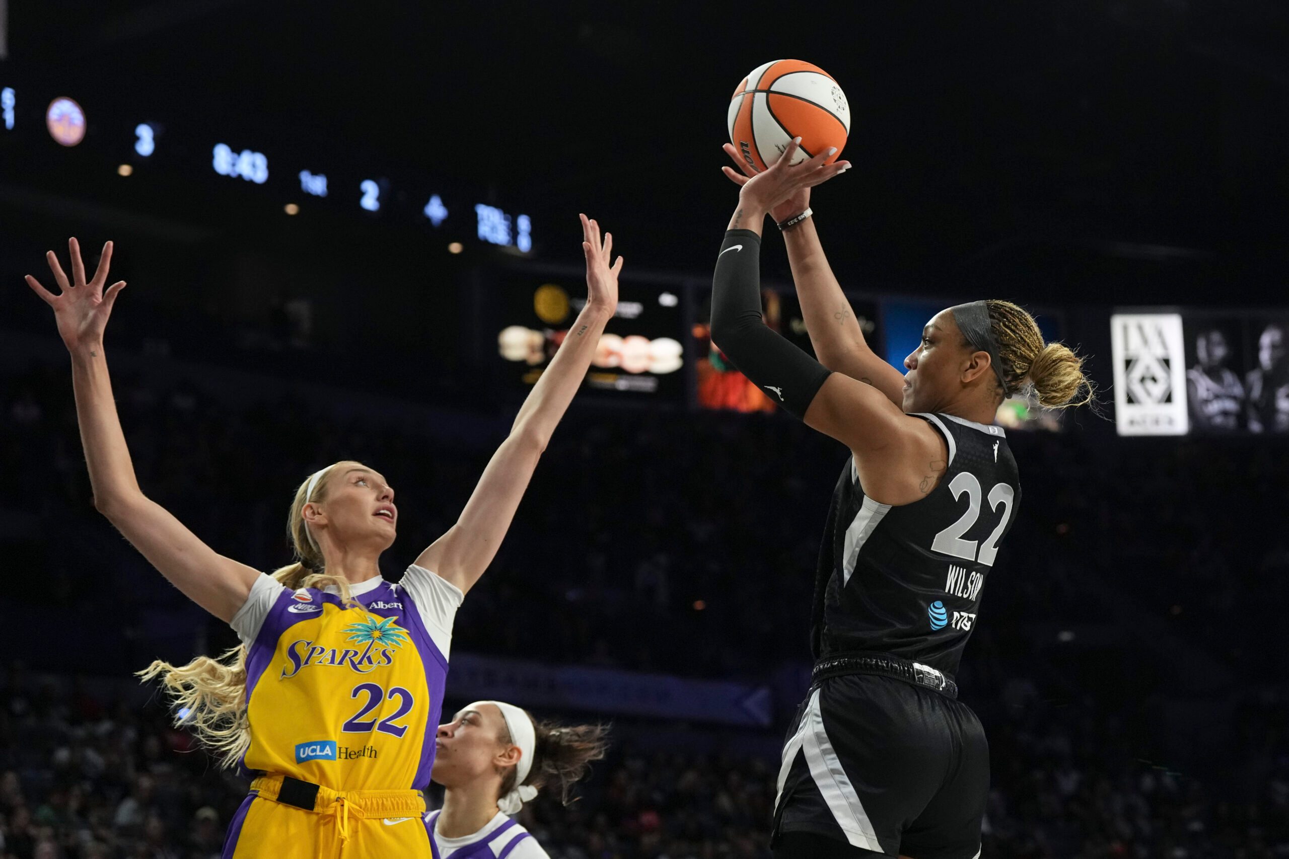 May 23, 2026; Las Vegas, Nevada, USA;  Las Vegas Aces center A'ja Wilson (22) shoots against Los Angeles Sparks forward Cameron Brink (22) in the first quarter of their game at Michelob Ultra Arena. Mandatory Credit: Candice Ward-Imagn Images