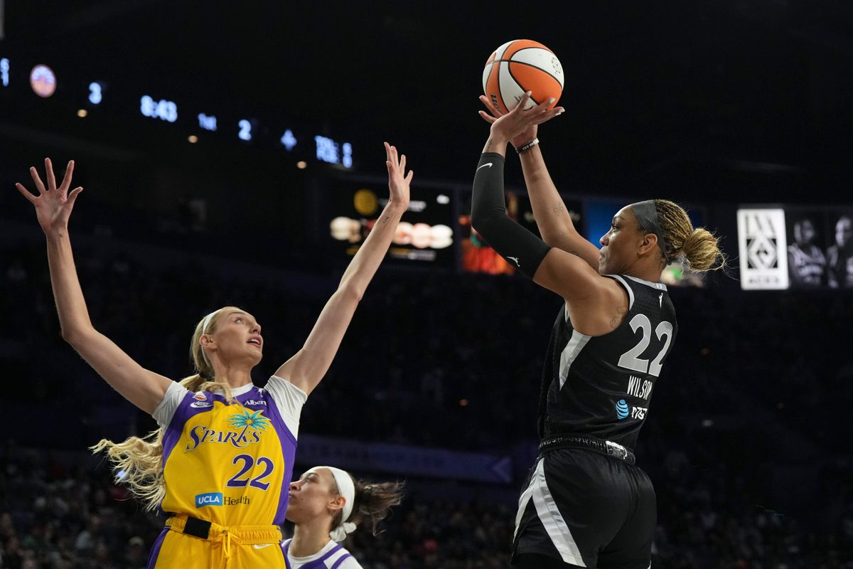 May 23, 2026; Las Vegas, Nevada, USA;  Las Vegas Aces center A'ja Wilson (22) shoots against Los Angeles Sparks forward Cameron Brink (22) in the first quarter of their game at Michelob Ultra Arena. Mandatory Credit: Candice Ward-Imagn Images