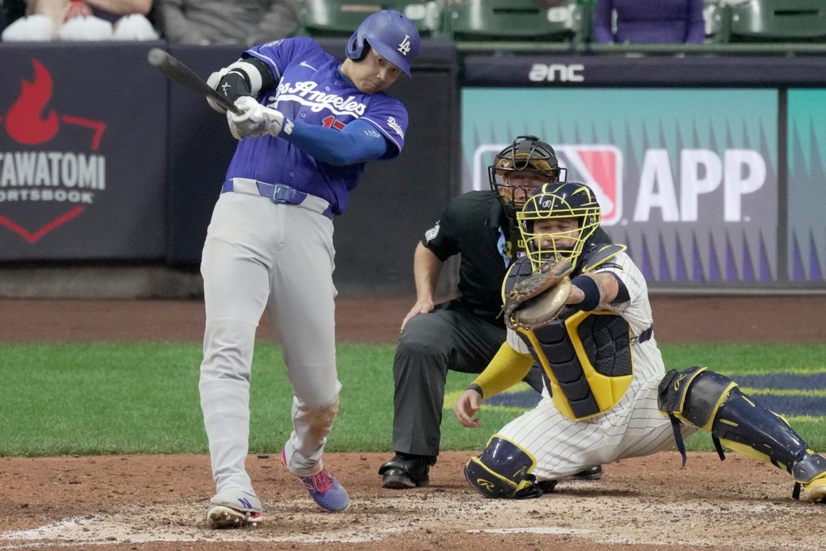 Los Angeles Dodgers two-way player Shohei Ohtani (17) hits an RBI single during the ninth inning of their game against the Milwaukee Brewers Saturday, May 23, 2026 at American Family Field in Milwaukee, Wisconsin.