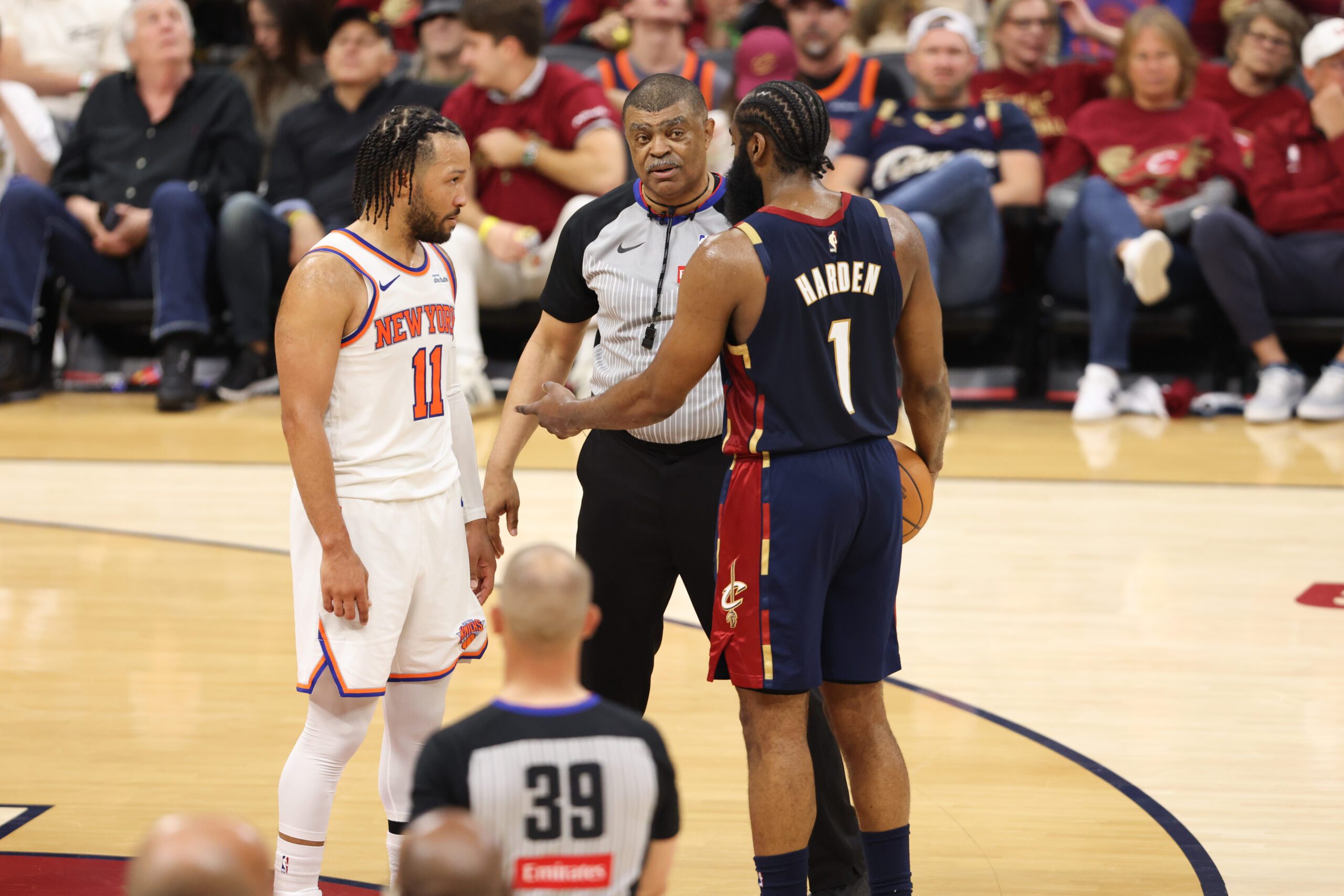 May 23, 2026; Cleveland, Ohio, USA; New York Knicks guard Jalen Brunson (11) and Cleveland Cavaliers guard James Harden (1) prepare for a jump ball in the fourth quarter during game three of the eastern conference finals for the 2026 NBA playoffs at Rocket Arena. Mandatory Credit: Scott Galvin-Imagn Images