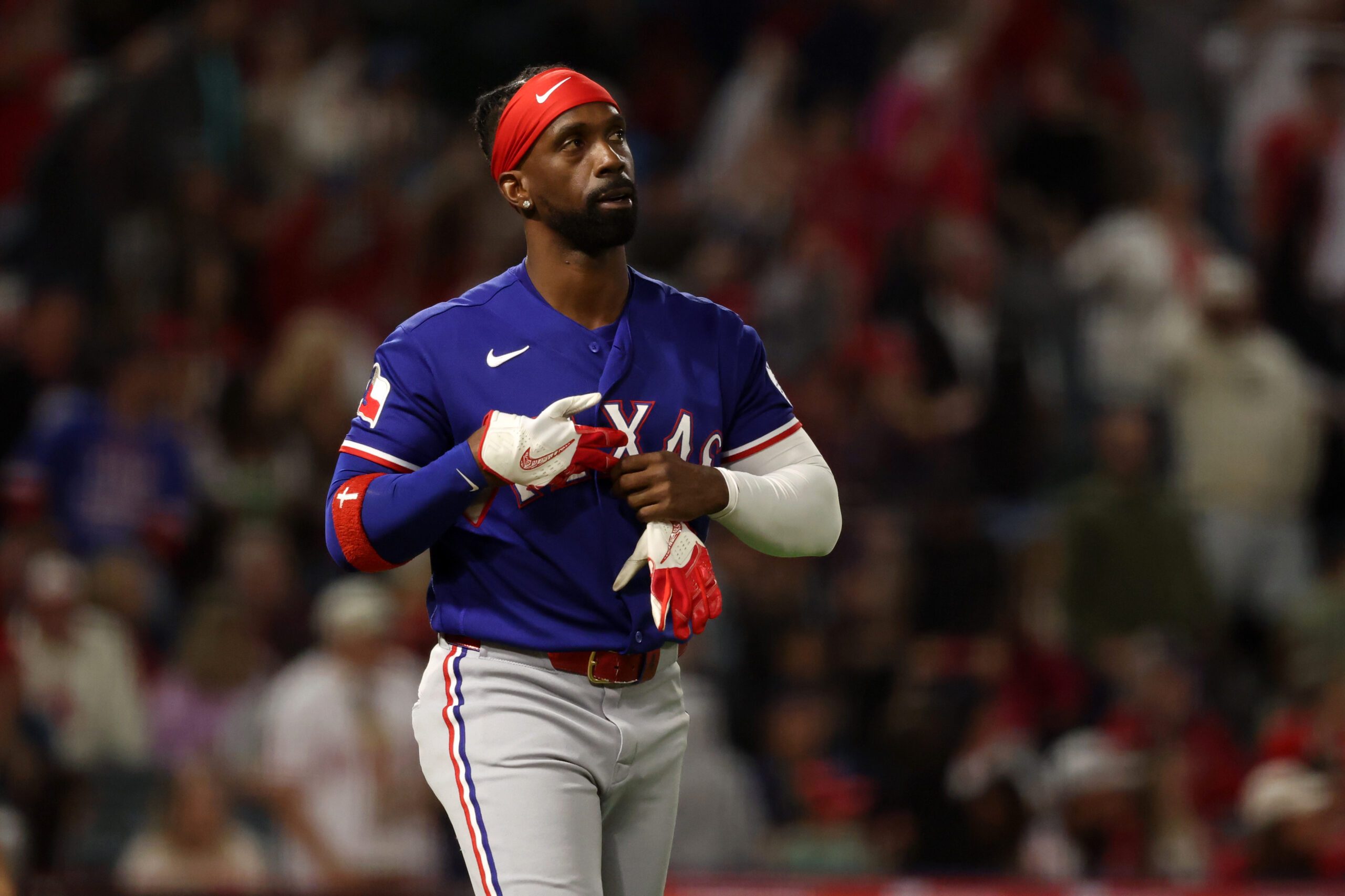 May 23, 2026; Anaheim, California, USA;  Texas Rangers pinch hitter Andrew McCutchen (4) reacts after strike out during the seventh inning against the Los Angeles Angels at Angel Stadium. Mandatory Credit: Kiyoshi Mio-Imagn Images