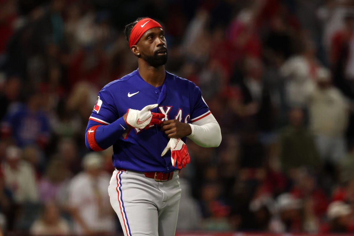 May 23, 2026; Anaheim, California, USA;  Texas Rangers pinch hitter Andrew McCutchen (4) reacts after strike out during the seventh inning against the Los Angeles Angels at Angel Stadium. Mandatory Credit: Kiyoshi Mio-Imagn Images