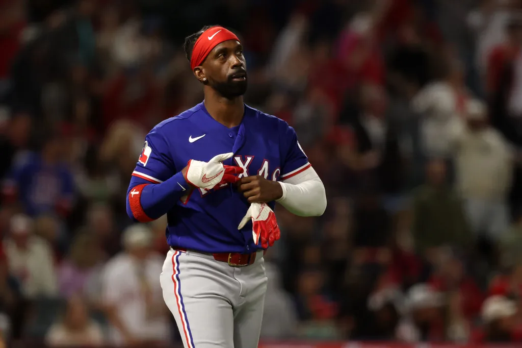 May 23, 2026; Anaheim, California, USA; Texas Rangers pinch hitter Andrew McCutchen (4) reacts after strike out during the seventh inning against the Los Angeles Angels at Angel Stadium. Mandatory Credit: Kiyoshi Mio-Imagn Images