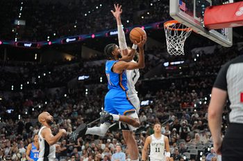 May 24, 2026; San Antonio, Texas, USA; Oklahoma City Thunder guard Isaiah Joe (11) shoots while defended by Oklahoma City Thunder center Chet Holmgren (7) in the fourth quarter during game four of the western conference finals for the 2026 NBA playoffs at Frost Bank Center. Mandatory Credit: Daniel Dunn-Imagn Images