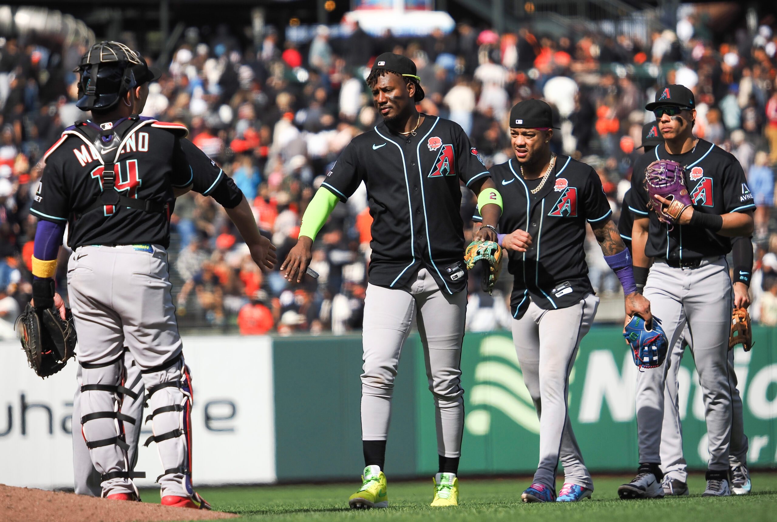 May 25, 2026; San Francisco, California, USA; Arizona Diamondbacks players high five after the game against the San Francisco Giants at Oracle Park. Mandatory Credit: Kelley L Cox-Imagn Images