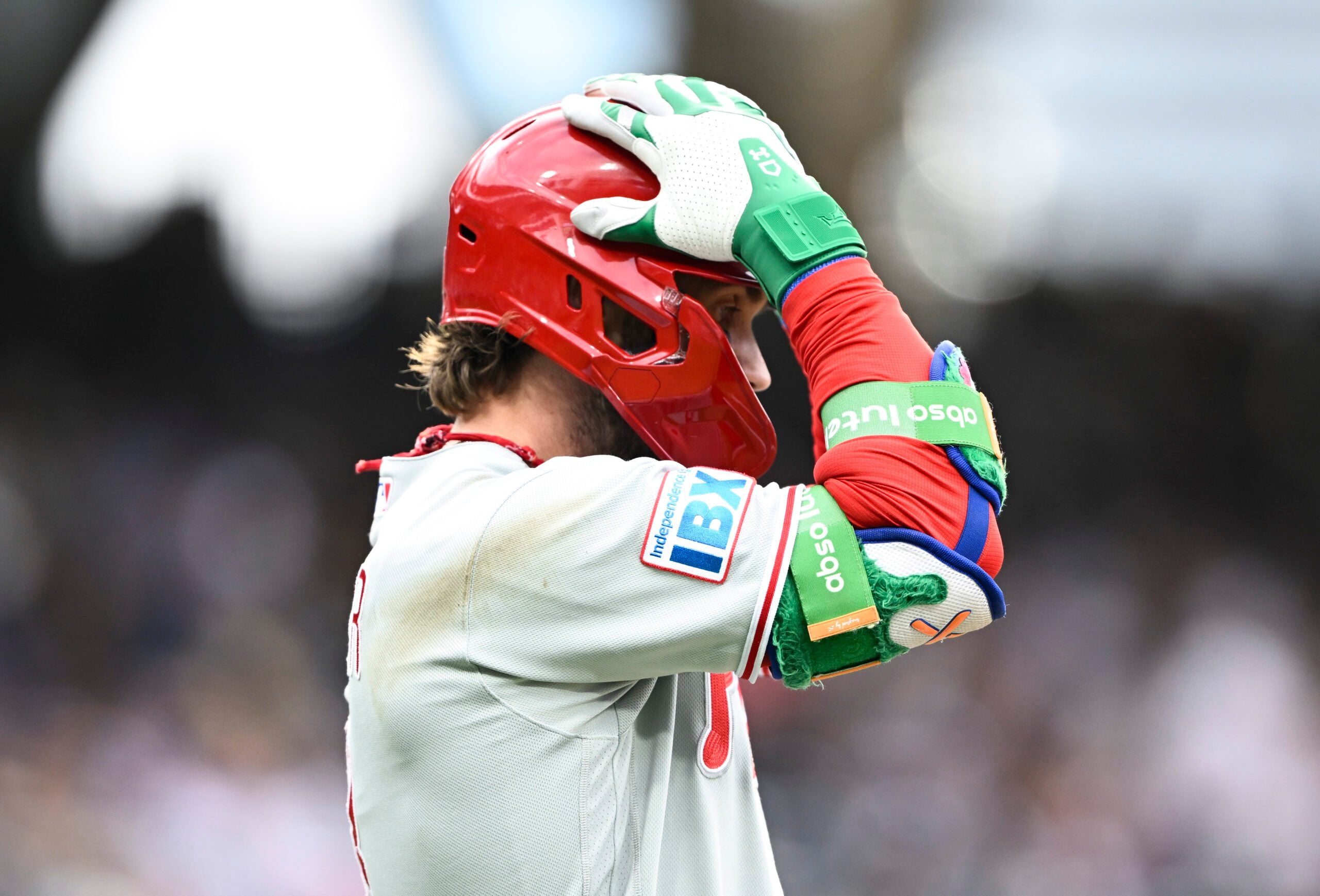 May 25, 2026; San Diego, California, USA; Philadelphia Phillies first baseman Bryce Harper (3) grabs his helmet after hitting a long fly ball during the ninth inning against the San Diego Padres at Petco Park. Mandatory Credit: Denis Poroy-Imagn Images