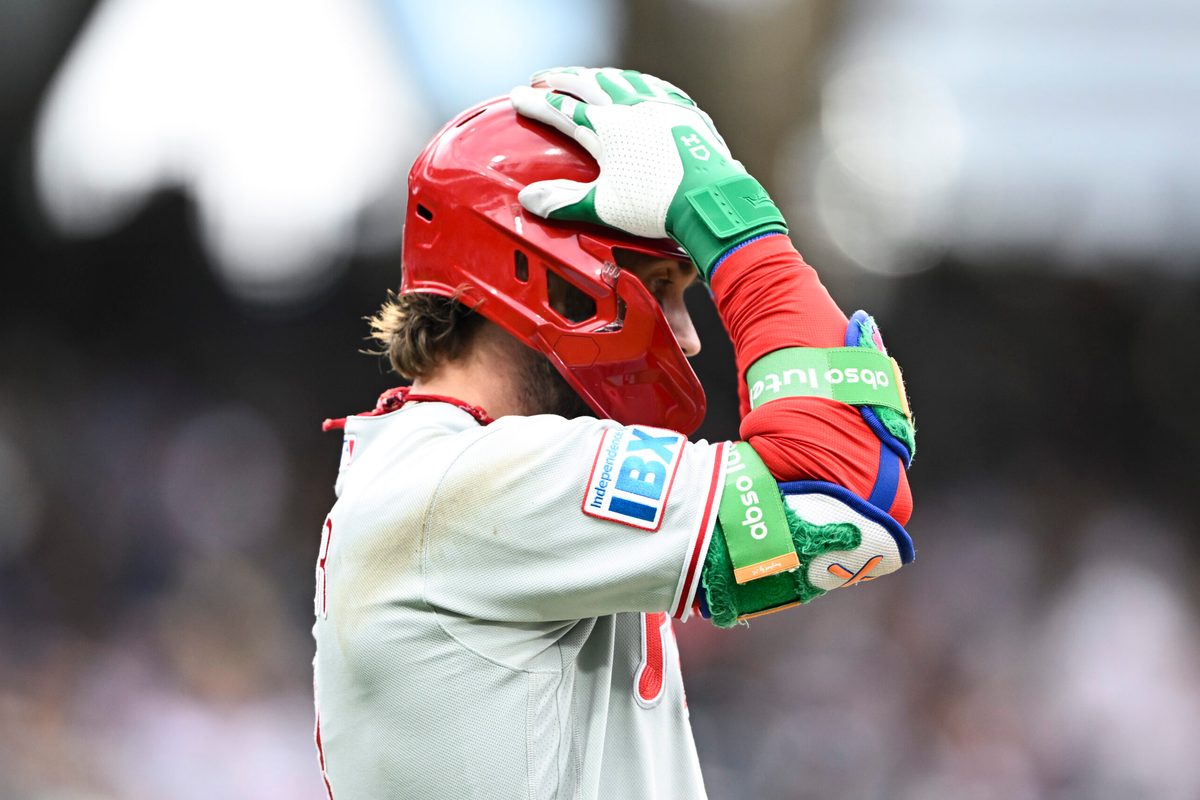 May 25, 2026; San Diego, California, USA; Philadelphia Phillies first baseman Bryce Harper (3) grabs his helmet after hitting a long fly ball during the ninth inning against the San Diego Padres at Petco Park. Mandatory Credit: Denis Poroy-Imagn Images