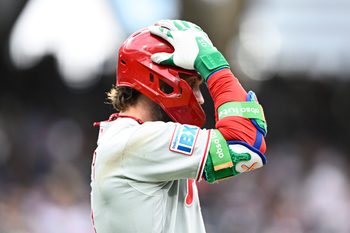 May 25, 2026; San Diego, California, USA; Philadelphia Phillies first baseman Bryce Harper (3) grabs his helmet after hitting a long fly ball during the ninth inning against the San Diego Padres at Petco Park. Mandatory Credit: Denis Poroy-Imagn Images