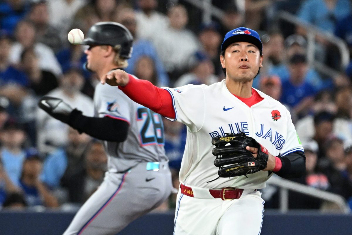 May 25, 2026; Toronto, Ontario, CAN;  Toronto Blue Jays third baseman Kazuma Okamoto (7) throws to first base to put out Miami Marlins center fielder Jakob Marsee (not shown) in the eighth inning at Rogers Centre. Mandatory Credit: Dan Hamilton-Imagn Images