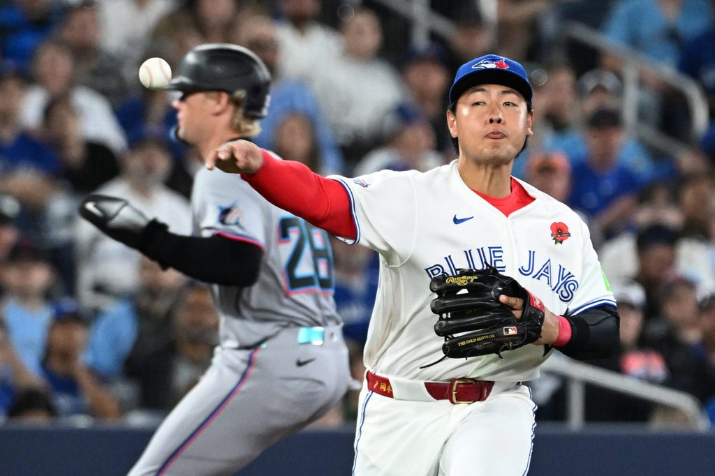 May 25, 2026; Toronto, Ontario, CAN; Toronto Blue Jays third baseman Kazuma Okamoto (7) throws to first base to put out Miami Marlins center fielder Jakob Marsee (not shown) in the eighth inning at Rogers Centre. Mandatory Credit: Dan Hamilton-Imagn Images