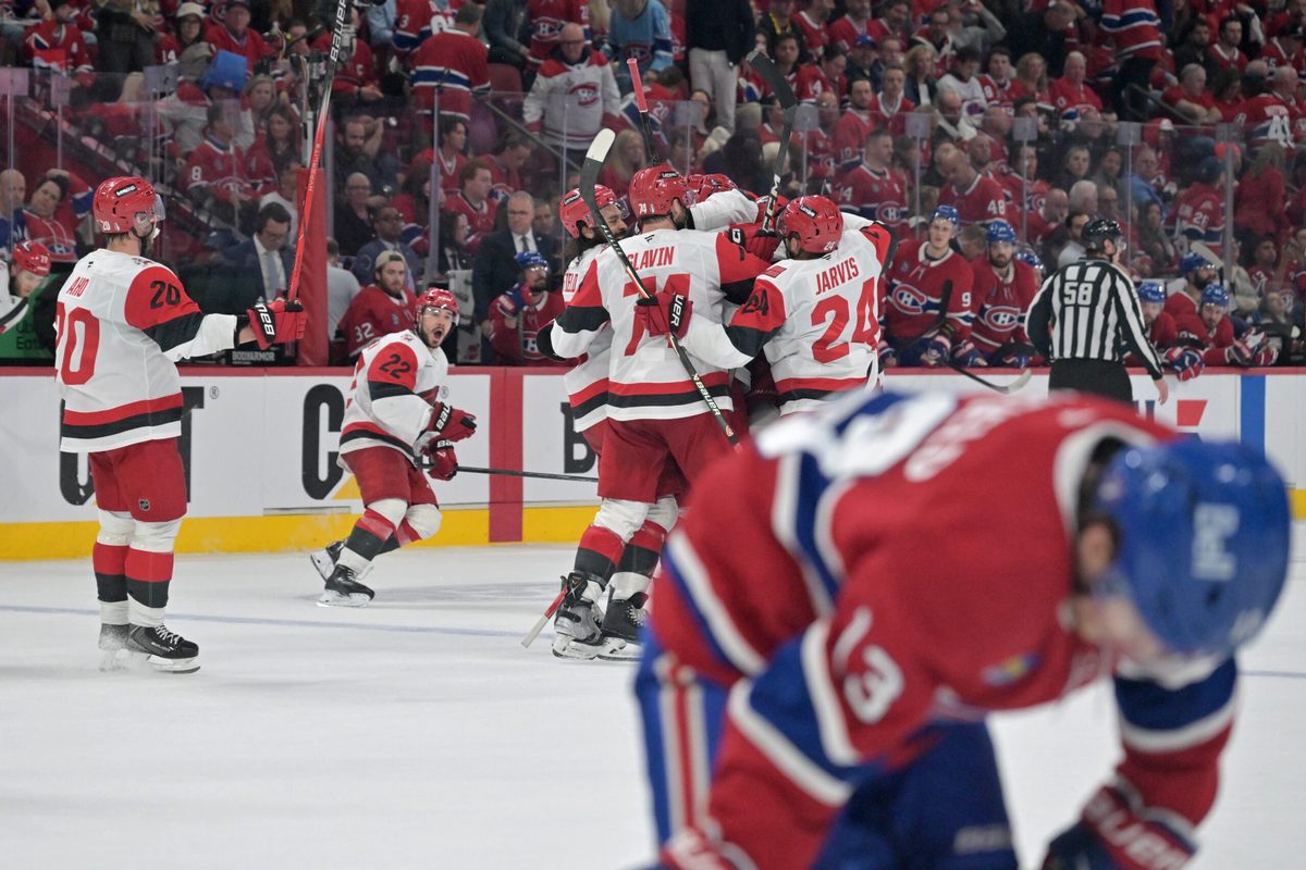 May 25, 2026; Montreal, Quebec, CAN; Carolina Hurricanes players celebrate after winning game three of the Eastern Conference Final against the Montreal Canadiens of the 2026 Stanley Cup Playoffs at Bell Centre. Mandatory Credit: Eric Bolte-Imagn Images