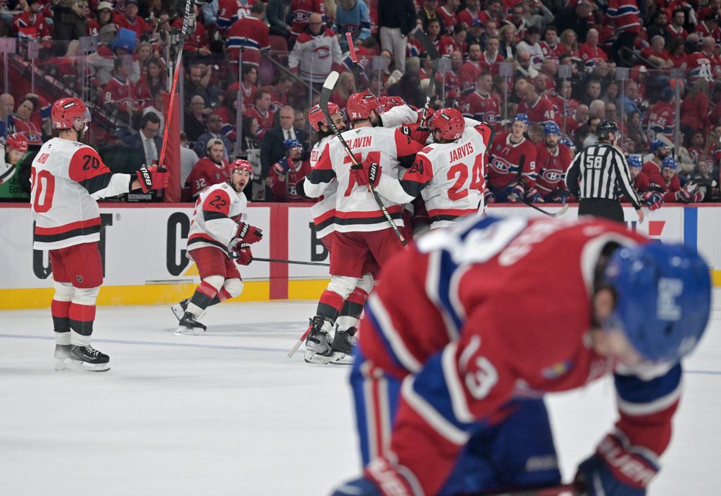 May 25, 2026; Montreal, Quebec, CAN; Carolina Hurricanes players celebrate after winning game three of the Eastern Conference Final against the Montreal Canadiens of the 2026 Stanley Cup Playoffs at Bell Centre. Mandatory Credit: Eric Bolte-Imagn Images