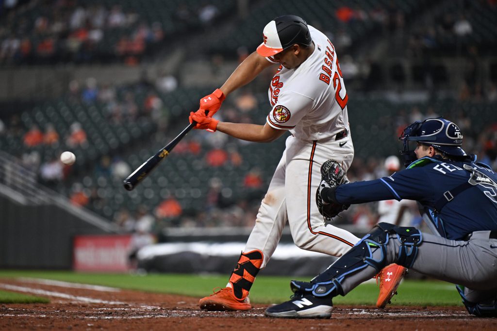 May 26, 2026; Baltimore, Maryland, USA; Baltimore Orioles catcher Samuel Basallo (29) hits a three-run home run in the fifth inning against the Tampa Bay Rays at Oriole Park at Camden Yards. Mandatory Credit: Jamie Sabau-Imagn Images