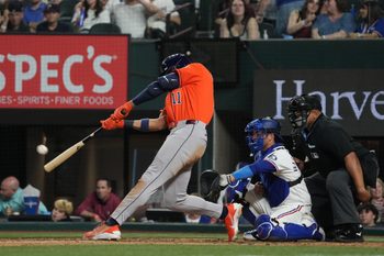 May 26, 2026; Arlington, Texas, USA; Houston Astros right fielder Cam Smith (11) hits a solo home run against the Texas Rangers during the eighth inning at Globe Life Field. Mandatory Credit: Raymond Carlin III-Imagn Images