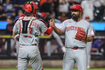 May 26, 2026; New York City, New York, USA;  Cincinnati Reds relief pitcher Tony Santillan (64) and catcher Tyler Stephenson (37) celebrate after defeating the New York Mets 7-2 at Citi Field. Mandatory Credit: Wendell Cruz-Imagn Images