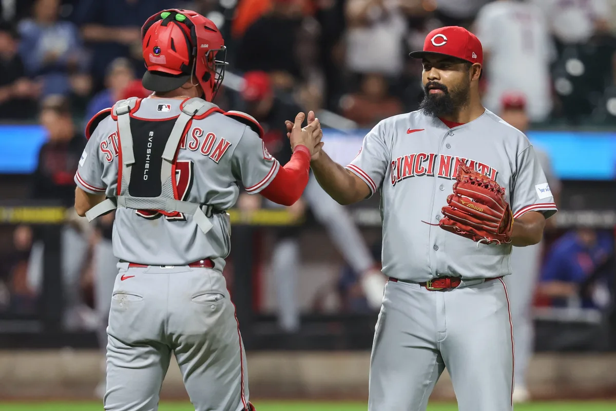 May 26, 2026; New York City, New York, USA; Cincinnati Reds relief pitcher Tony Santillan (64) and catcher Tyler Stephenson (37) celebrate after defeating the New York Mets 7-2 at Citi Field. Mandatory Credit: Wendell Cruz-Imagn Images