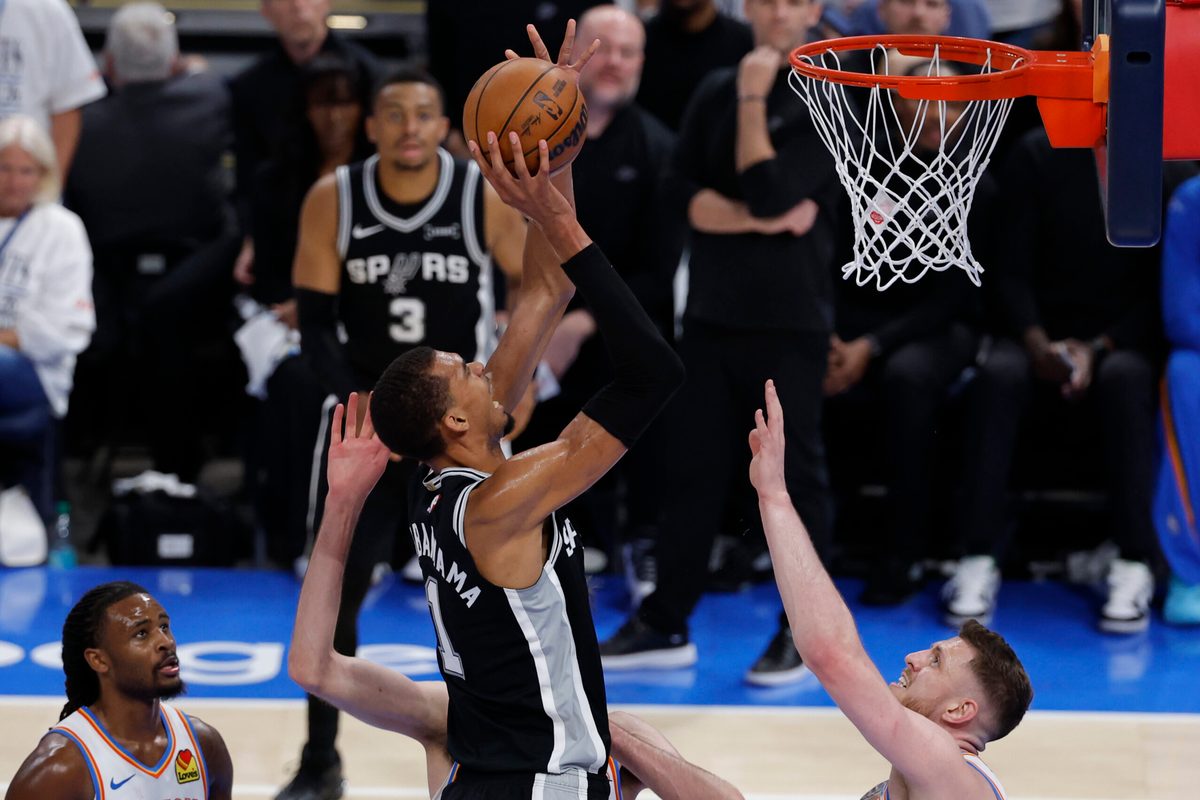 May 26, 2026; Oklahoma City, Oklahoma, USA; San Antonio Spurs forward Victor Wembanyama (1) shoots against Oklahoma City Thunder center Isaiah Hartenstein (55) during the fourth quarter in game five of the western conference finals for the 2026 NBA playoffs at Paycom Center. Mandatory Credit: Alonzo Adams-Imagn Images