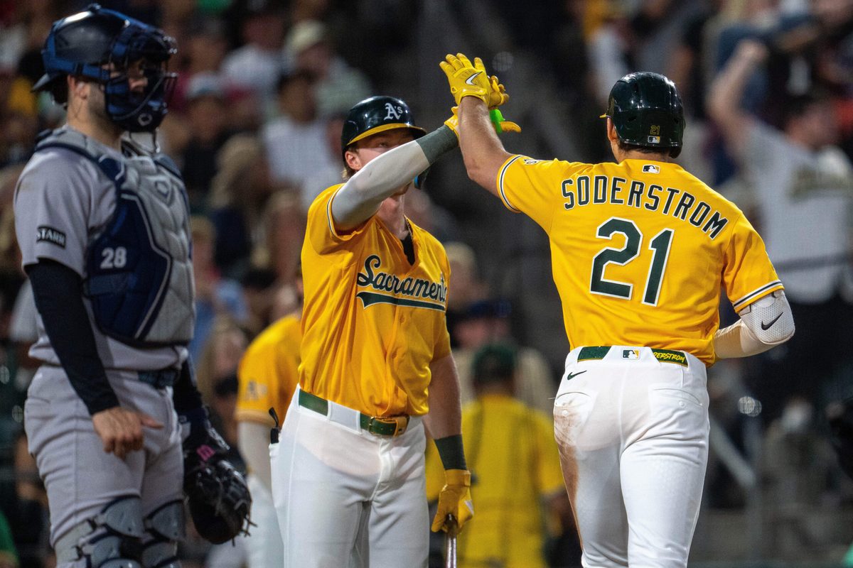 May 30, 2026; West Sacramento, California, USA; Athletics left fielder Tyler Soderstrom (21) and Athletics center fielder Henry Bolte (33) celebrate after the solo home run against the New York Yankees during the sixth inning at Sutter Health Park. Mandatory Credit: Neville E. Guard-Imagn Images