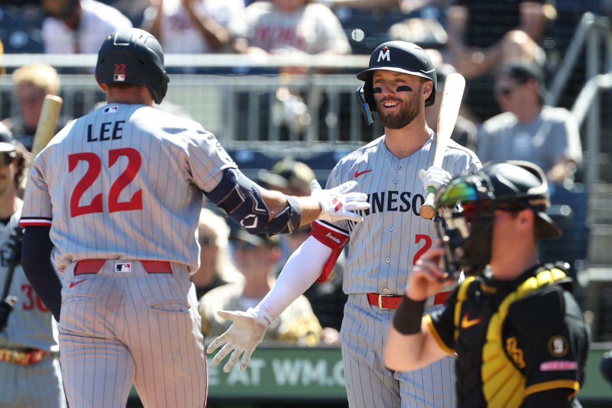 May 31, 2026; Pittsburgh, Pennsylvania, USA;  Minnesota Twins center fielder Kody Clemens (right) greets third baseman Brooks Lee (22) crossing home plate on a solo home run which was his second home run of the game during the ninth inning against the Pittsburgh Pirates at PNC Park. Mandatory Credit: Charles LeClaire-Imagn Images