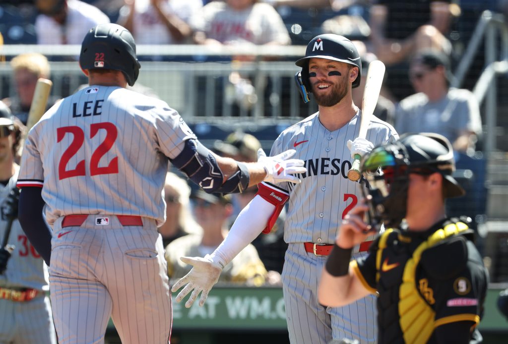 May 31, 2026; Pittsburgh, Pennsylvania, USA; Minnesota Twins center fielder Kody Clemens (right) greets third baseman Brooks Lee (22) crossing home plate on a solo home run which was his second home run of the game during the ninth inning against the Pittsburgh Pirates at PNC Park. Mandatory Credit: Charles LeClaire-Imagn Images