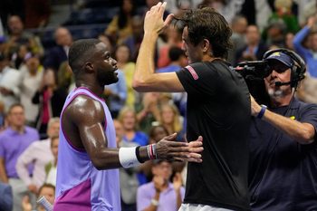 Sept 6, 2024; Flushing, NY, USA; Taylor Fritz (USA) (right) after beating Frances Tiafoe (USA) in the men's semifinals on day twelve of the 2024 U.S. Open tennis tournament at USTA Billie Jean King National Tennis Center. Mandatory Credit: Robert Deutsch-Imagn Images