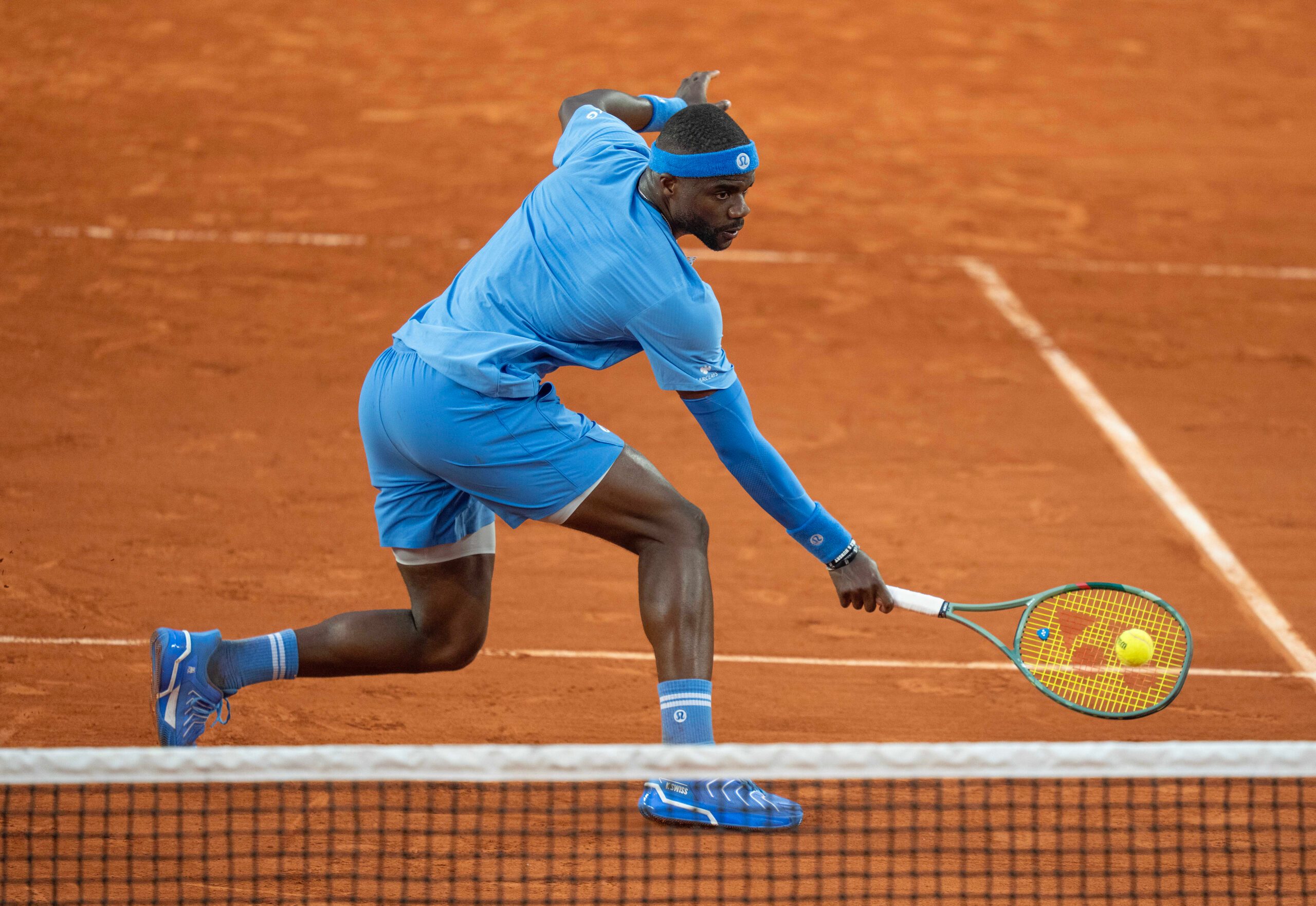 Jun 1, 2025; Paris, FR; Frances Tiafoe of the United States returns a shot during his match against Daniel Altmaier of Germany on day eight at Roland Garros Stadium.  Mandatory Credit: Susan Mullane-Imagn Images