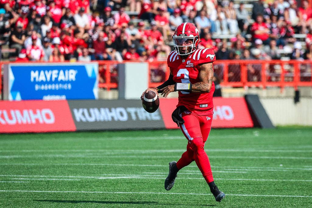 Jun 7, 2025; Calgary, Alberta, Canada; Calgary Stampeders quarterback Vernon Adams Jr (3) runs with the ball against the Hamilton Tiger-Cats during the first half at McMahon Stadium. Mandatory Credit: Sergei Belski-Imagn Images