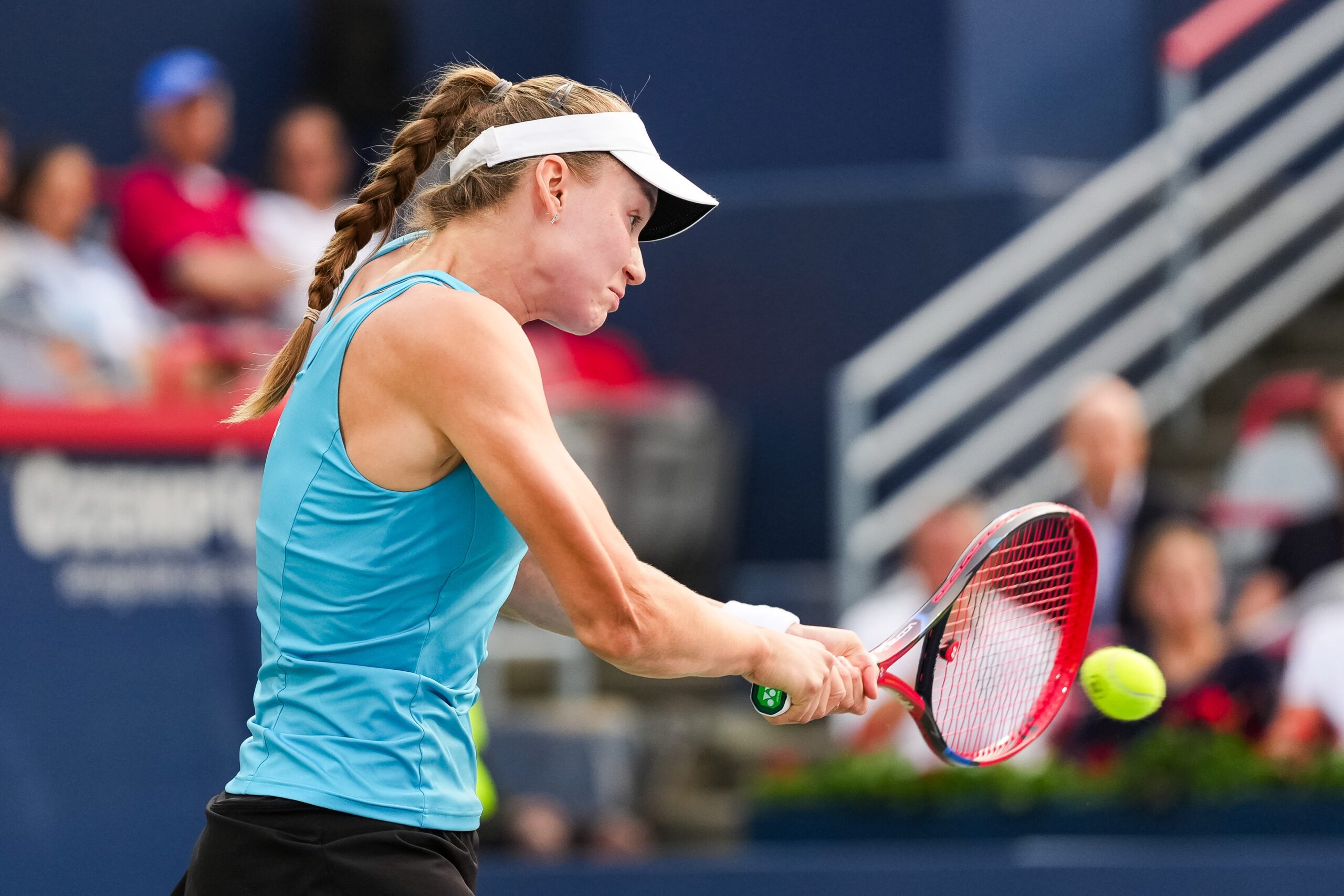 Aug 4, 2025; Montreal, QC, Canada; Elena Rybakina (KAZ) returns the ball to Marta Kostyuk (UKR) in quarterfinal play at IGA Stadium. Mandatory Credit: David Kirouac-Imagn Images