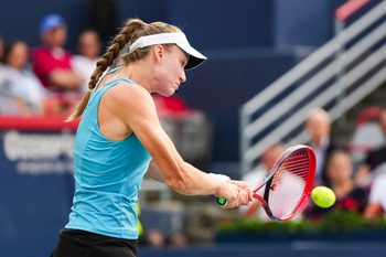 Aug 4, 2025; Montreal, QC, Canada; Elena Rybakina (KAZ) returns the ball to Marta Kostyuk (UKR) in quarterfinal play at IGA Stadium. Mandatory Credit: David Kirouac-Imagn Images