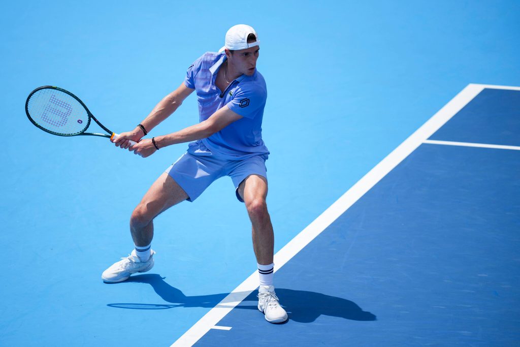 Aug 11, 2025; Cincinnati, OH, USA; Ugo Humbert (FRA) returns a shot against Frances Tiafoe (USA) during the Cincinnati Open at the Lindner Family Tennis Center. Mandatory Credit: Aaron Doster-Imagn Images