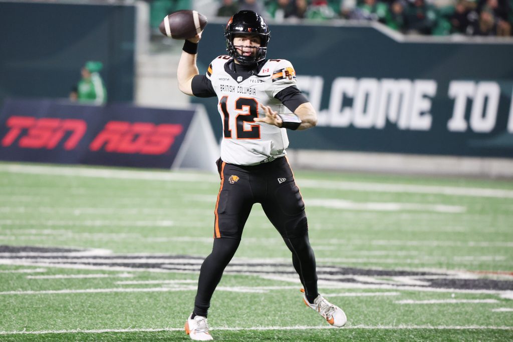 Nov 8, 2025; Regina, Saskatchewan, Canada; BC Lions quarterback Nathan Rourke (12) looks for a receiver downfield during the second half of the CFL Western Conference Final between the BC Lions and the Saskatchewan Roughriders at Mosaic Stadium. Mandatory Credit: Bruce Fedyck-Imagn Images