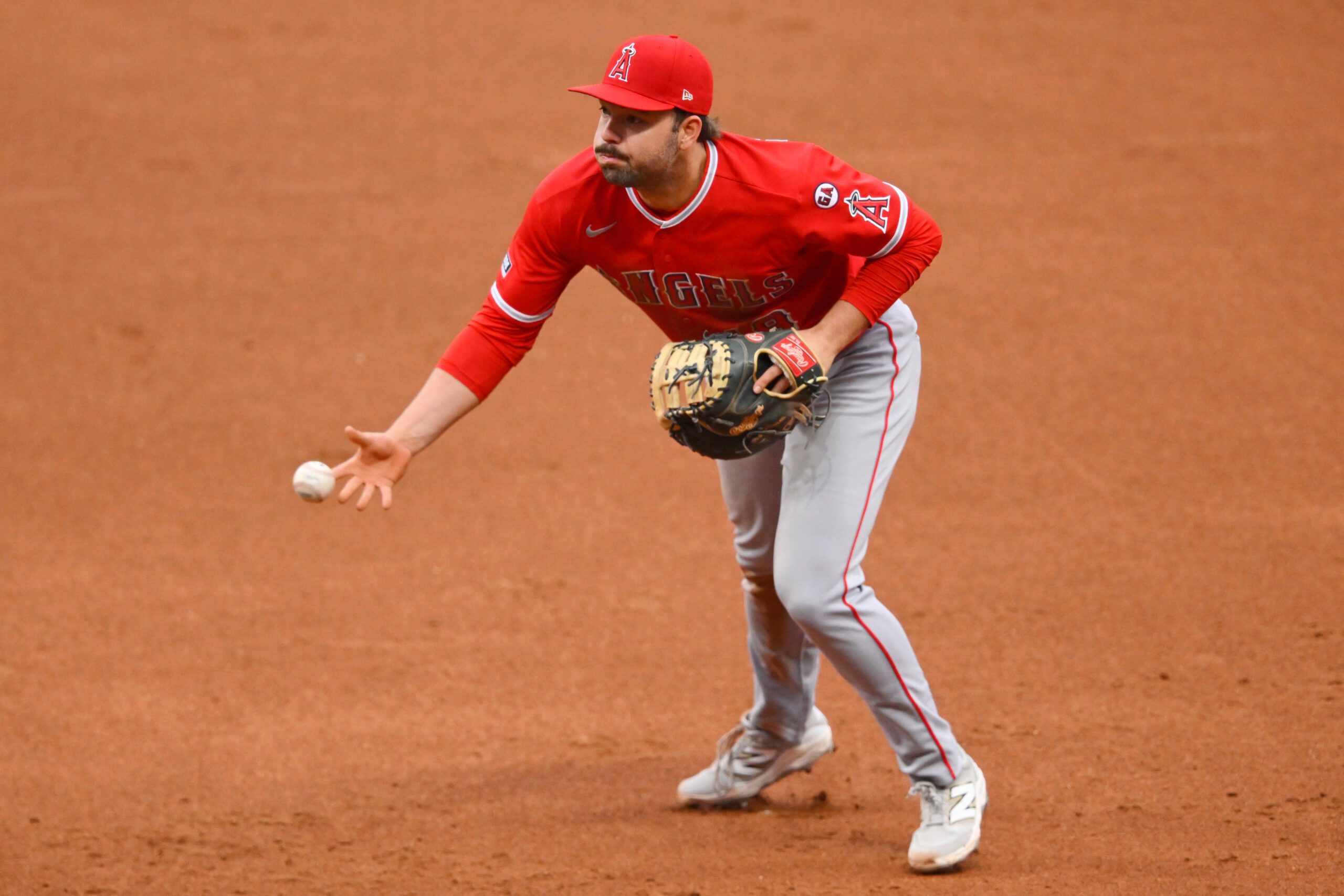 May 12, 2026; Cleveland, Ohio, USA; Los Angeles Angels first baseman Nolan Schanuel (18) tosses the ball to first in the third inning against the Cleveland Guardians at Progressive Field. Mandatory Credit: David Richard-Imagn Images