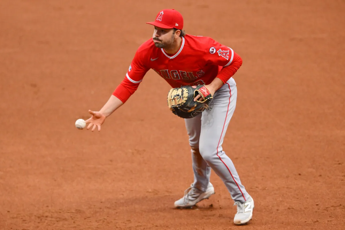 May 12, 2026; Cleveland, Ohio, USA; Los Angeles Angels first baseman Nolan Schanuel (18) tosses the ball to first in the third inning against the Cleveland Guardians at Progressive Field. Mandatory Credit: David Richard-Imagn Images