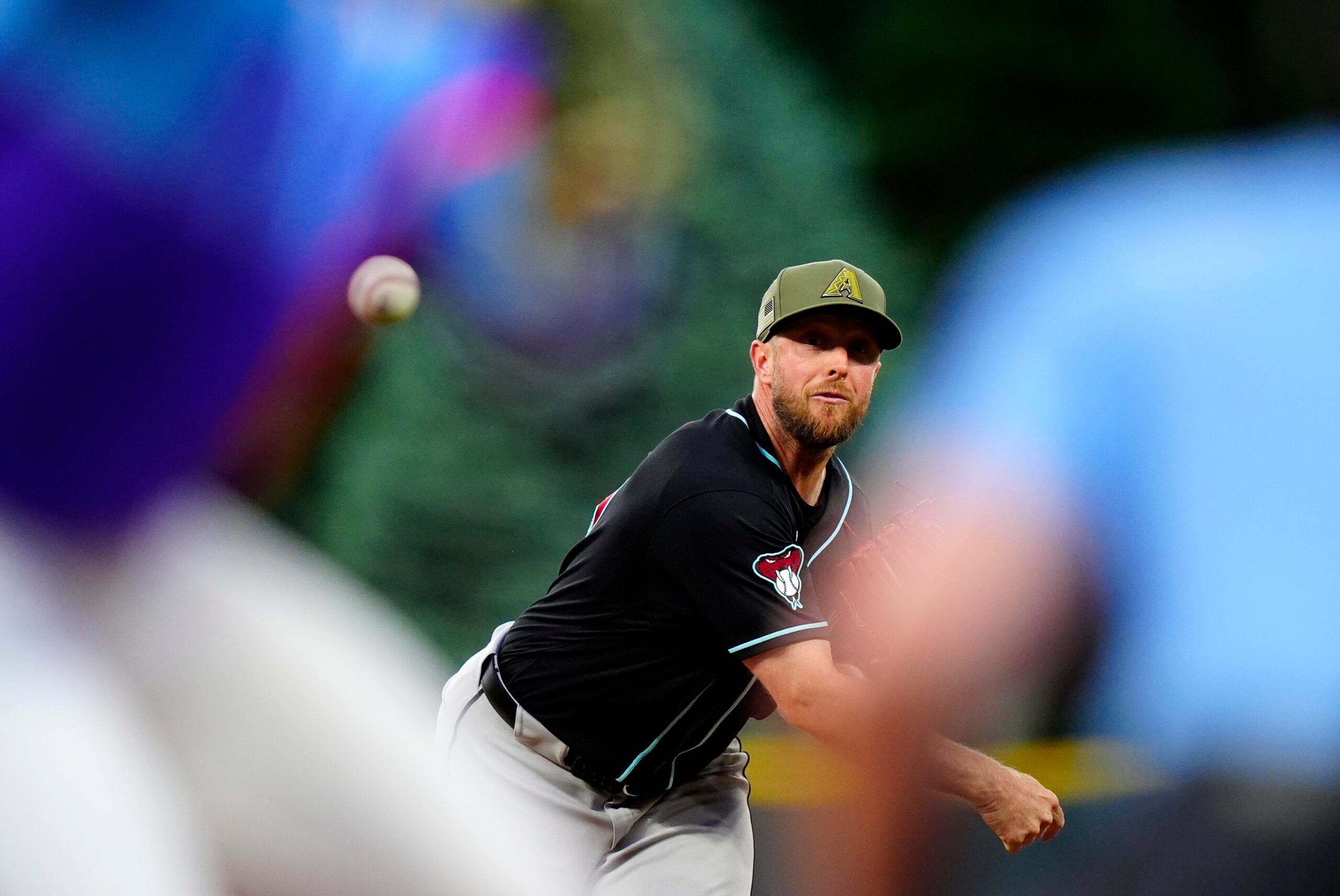 May 15, 2026; Denver, Colorado, USA; Arizona Diamondbacks starting pitcher Merrill Kelly (29) delivers a pitch in the first inning against the Colorado Rockies at Coors Field. Mandatory Credit: Ron Chenoy-Imagn Images