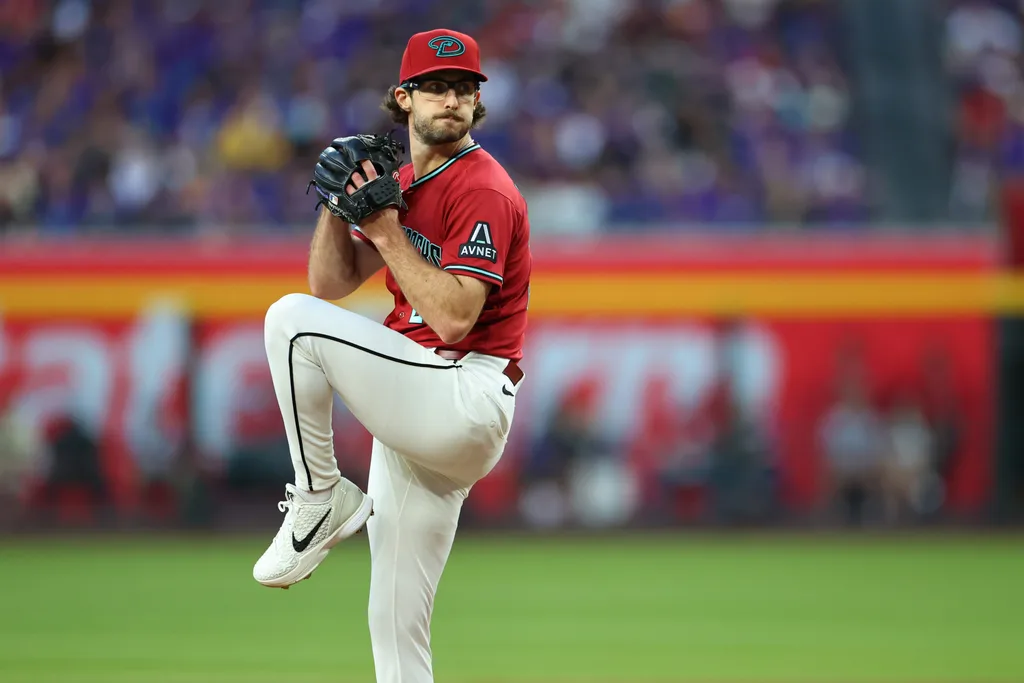 May 23, 2026; Phoenix, Arizona, USA; Arizona Diamondbacks pitcher Zac Gallen (23) prepares to throw a pitch against the Colorado Rockies during the first inning at Chase Field. Mandatory Credit: Anna Carrington-Imagn Images