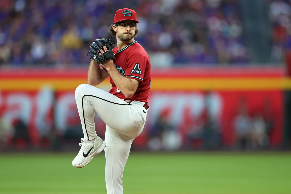May 23, 2026; Phoenix, Arizona, USA; Arizona Diamondbacks pitcher Zac Gallen (23) prepares to throw a pitch against the Colorado Rockies during the first inning at Chase Field. Mandatory Credit: Anna Carrington-Imagn Images