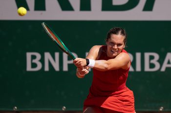 May 27, 2026; Paris, France; Caty McNally of the United States returns a shot during her match against Belinda Bencic of Switzerland on day four at Stade Roland Garros. Mandatory Credit: Susan Mullane-Imagn Images