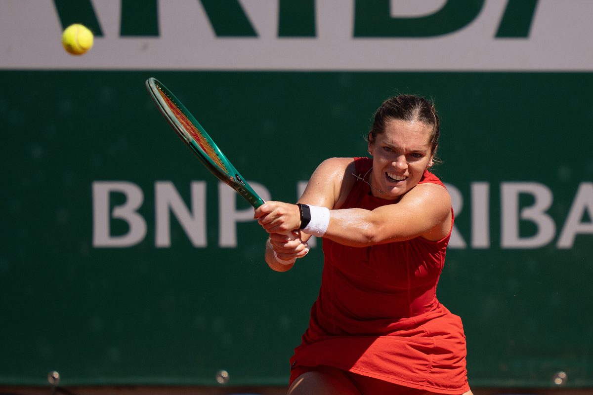 May 27, 2026; Paris, France; Caty McNally of the United States returns a shot during her match against Belinda Bencic of Switzerland on day four at Stade Roland Garros. Mandatory Credit: Susan Mullane-Imagn Images