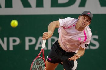 May 27, 2026; Paris, France; Tommy Paul of the United States serves during his match against Lorenzo Musetti of Italy on day four at Stade Roland Garros. Mandatory Credit: Susan Mullane-Imagn Images
