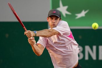 May 27, 2026; Paris, France; Tommy Paul of the United States returns a shot during his match against Lorenzo Musetti of Italy on day four at Stade Roland Garros. Mandatory Credit: Susan Mullane-Imagn Images