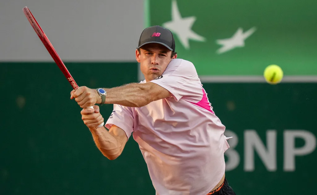 May 27, 2026; Paris, France; Tommy Paul of the United States returns a shot during his match against Lorenzo Musetti of Italy on day four at Stade Roland Garros. Mandatory Credit: Susan Mullane-Imagn Images