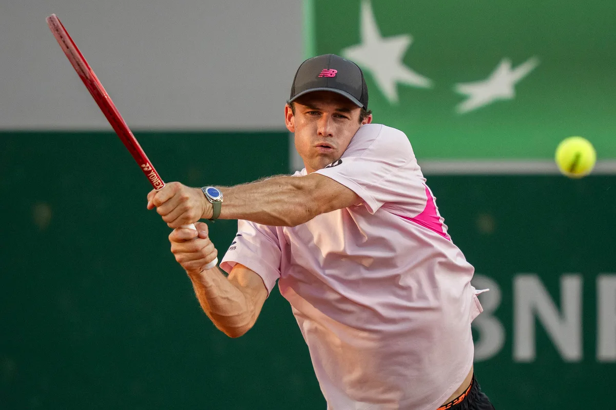 May 27, 2026; Paris, France; Tommy Paul of the United States returns a shot during his match against Lorenzo Musetti of Italy on day four at Stade Roland Garros. Mandatory Credit: Susan Mullane-Imagn Images