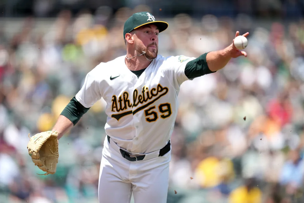 May 27, 2026; West Sacramento, California, USA; Athletics pitcher Jeffrey Springs (59) tosses the ball to first to record an out against the Seattle Mariners in the third inning at Sutter Health Park. Mandatory Credit: Cary Edmondson-Imagn Images