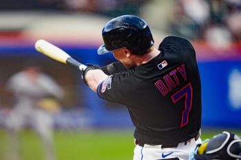 May 29, 2026; New York City, New York, USA; New York Mets right fielder Brett Baty (7) hits an RBI single against the Miami Marlins during the first inning at Citi Field. Mandatory Credit: Gregory Fisher-Imagn Images