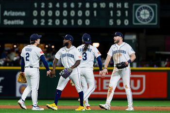 May 30, 2026; Seattle, Washington, USA; Seattle Mariners second baseman Cole Young (2), left fielder Randy Arozarena (56), shortstop J.P. Crawford (3) and right fielder Luke Raley (20) celebrate following the final out of a victory against the Arizona Diamondbacks at T-Mobile Park. Mandatory Credit: Joe Nicholson-Imagn Images