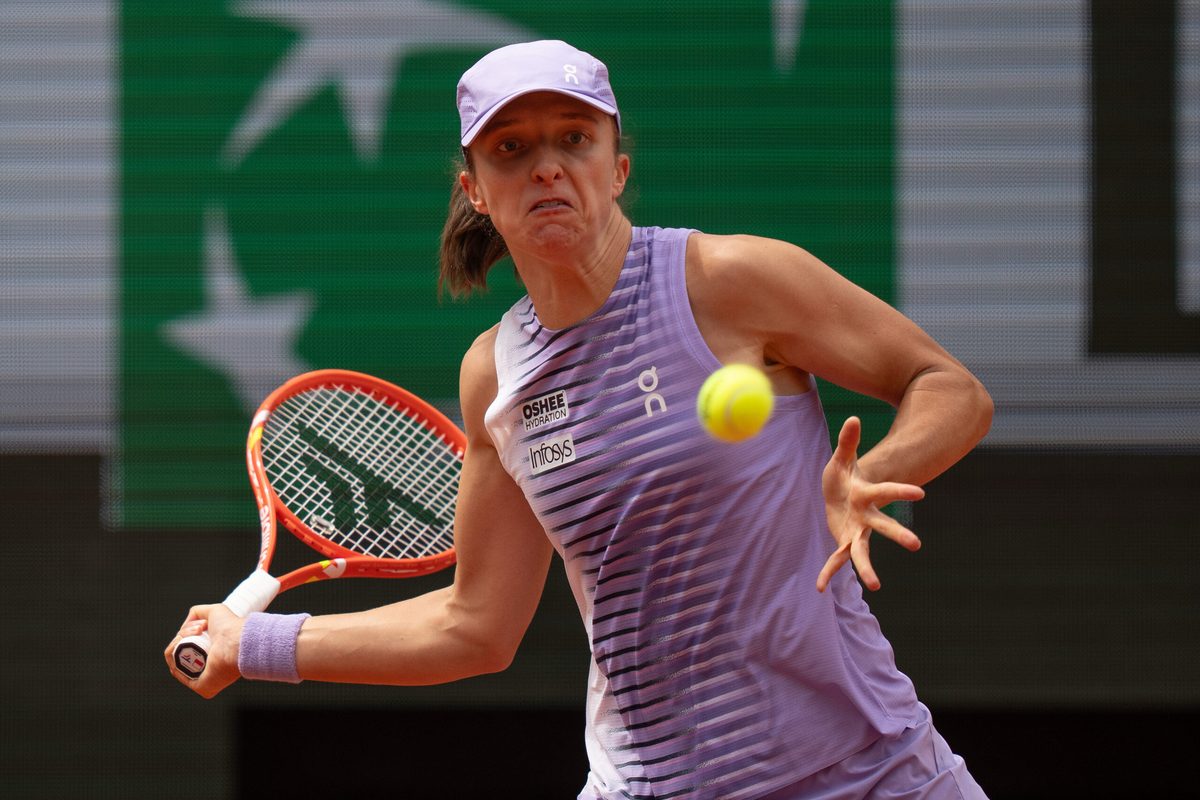 May 31, 2026; Paris, France; Iga Swiatek of Poland returns a shot during her match against Marta Kostyuk of Ukraine on day eight at Stade Roland Garros. Mandatory Credit: Susan Mullane-Imagn Images