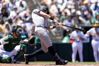 May 31, 2026; West Sacramento, California, USA; New York Yankees designated hitter Ben Rice (22) connects for a two-run double against the Athletics during the third inning at Sutter Health Park. Mandatory Credit: D. Ross Cameron-Imagn Images